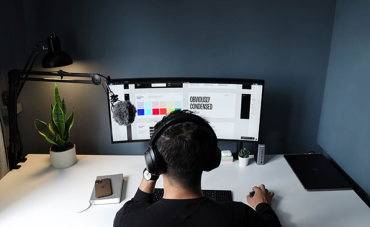 photo of a designer working at a computer